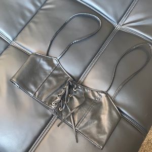 Black corset belt in a size small.